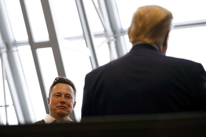 Vice President Mike Pence, his wife Karen, right, NASA administrator, Jim Bridenstine, center and CEO of SpaceX, Elon Musk, talk to the media after NASA astronauts Douglas Hurley and Robert Behnken left the Neil A. Armstrong Operations and Checkout Building on their way to Pad 39-A, at the Kennedy Space Center in Cape Canaveral, Fla., Wednesday, May 27, 2020. The two astronauts will fly on a SpaceX test flight to the International Space Station. For the first time in nearly a decade, astronauts will blast into orbit aboard an American rocket from American soil, a first for a private company. (AP Photo/John Raoux)