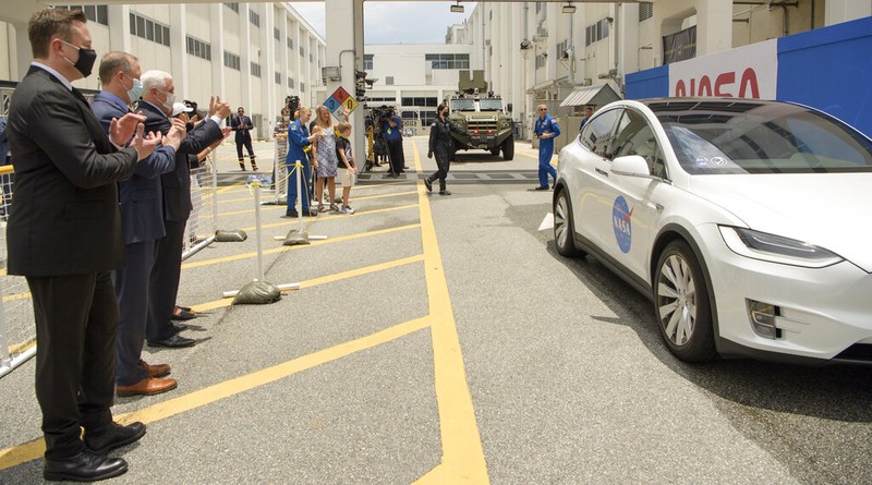 Vice President Mike Pence, his wife Karen, right, NASA administrator, Jim Bridenstine, center and CEO of SpaceX, Elon Musk, talk to the media after NASA astronauts Douglas Hurley and Robert Behnken left the Neil A. Armstrong Operations and Checkout Building on their way to Pad 39-A, at the Kennedy Space Center in Cape Canaveral, Fla., Wednesday, May 27, 2020. The two astronauts will fly on a SpaceX test flight to the International Space Station. For the first time in nearly a decade, astronauts will blast into orbit aboard an American rocket from American soil, a first for a private company. (AP Photo/John Raoux)