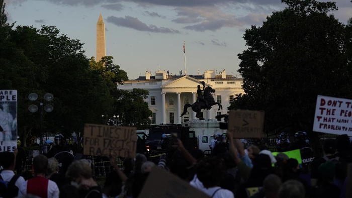 Demonstrators gather in front of the White House to protest the death of George Floyd, Saturday, May 30, 2020, in Washington. Floyd died after being restrained by Minneapolis police officers. (AP Photo/Evan Vucci)