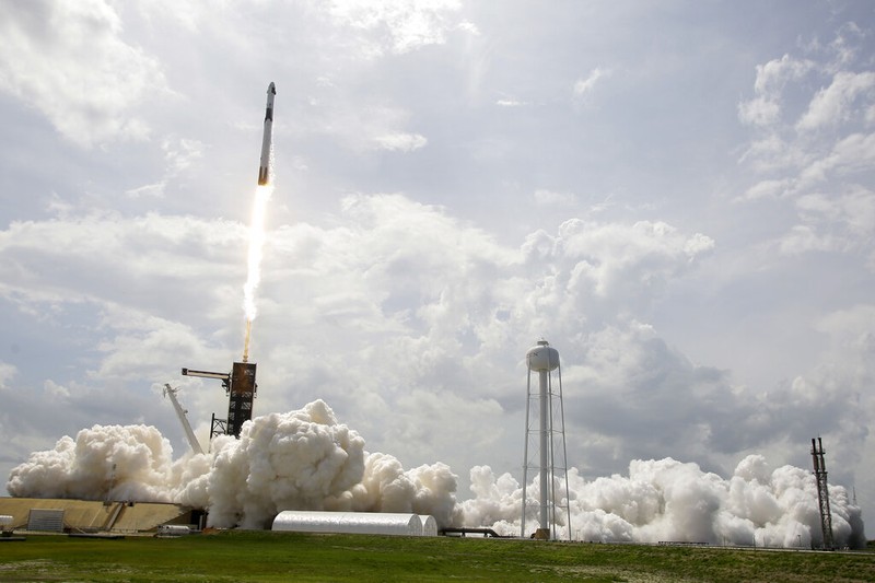Vice President Mike Pence, his wife Karen, right, NASA administrator, Jim Bridenstine, center and CEO of SpaceX, Elon Musk, talk to the media after NASA astronauts Douglas Hurley and Robert Behnken left the Neil A. Armstrong Operations and Checkout Building on their way to Pad 39-A, at the Kennedy Space Center in Cape Canaveral, Fla., Wednesday, May 27, 2020. The two astronauts will fly on a SpaceX test flight to the International Space Station. For the first time in nearly a decade, astronauts will blast into orbit aboard an American rocket from American soil, a first for a private company. (AP Photo/John Raoux)
