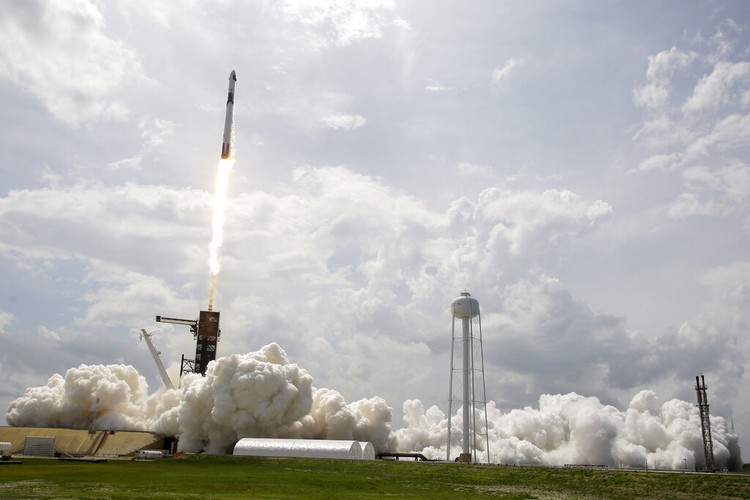 Elon Musk Vice President Mike Pence, his wife Karen, right, NASA administrator, Jim Bridenstine, center and CEO of SpaceX, Elon Musk, talk to the media after NASA astronauts Douglas Hurley and Robert Behnken left the Neil A. Armstrong Operations and Checkout Building on their way to Pad 39-A, at the Kennedy Space Center in Cape Canaveral, Fla., Wednesday, May 27, 2020. The two astronauts will fly on a SpaceX test flight to the International Space Station. For the first time in nearly a decade, astronauts will blast into orbit aboard an American rocket from American soil, a first for a private company. (AP Photo/John Raoux)