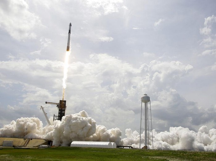 Vice President Mike Pence, his wife Karen, right, NASA administrator, Jim Bridenstine, center and CEO of SpaceX, Elon Musk, talk to the media after NASA astronauts Douglas Hurley and Robert Behnken left the Neil A. Armstrong Operations and Checkout Building on their way to Pad 39-A, at the Kennedy Space Center in Cape Canaveral, Fla., Wednesday, May 27, 2020. The two astronauts will fly on a SpaceX test flight to the International Space Station. For the first time in nearly a decade, astronauts will blast into orbit aboard an American rocket from American soil, a first for a private company. (AP Photo/John Raoux)