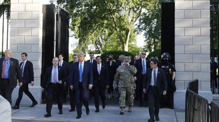 President Donald Trump walks from the gates of the White House to visit St. Johns Church across Lafayette Park Monday, June 1, 2020, in Washington. (AP Photo/Patrick Semansky)