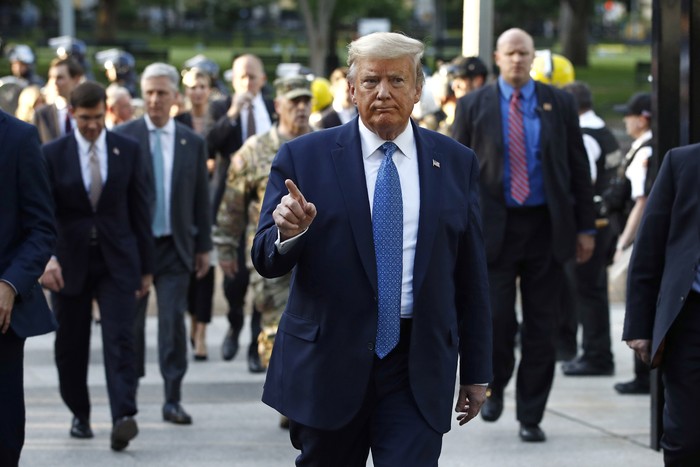 President Donald Trump returns to the White House after visiting outside St. Johns Church, Monday, June 1, 2020, in Washington. Part of the church was set on fire during protests on Sunday night. (AP Photo/Patrick Semansky)
