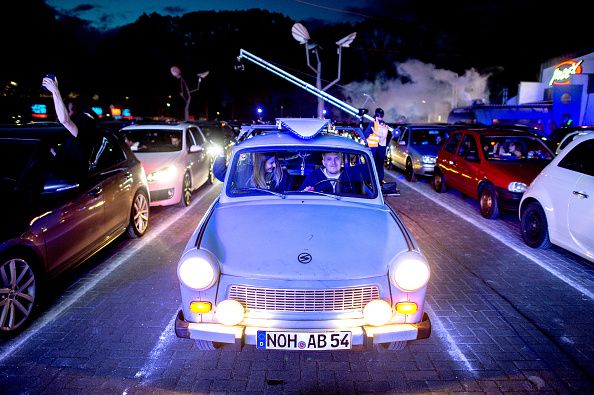 30 April 2020, Lower Saxony, Schüttorf: Guests park their cars during a car disco on the parking lot of the disco 