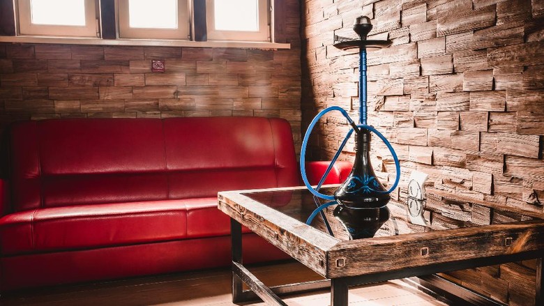Cozy room with bright sun from the window and furniture - hookah room