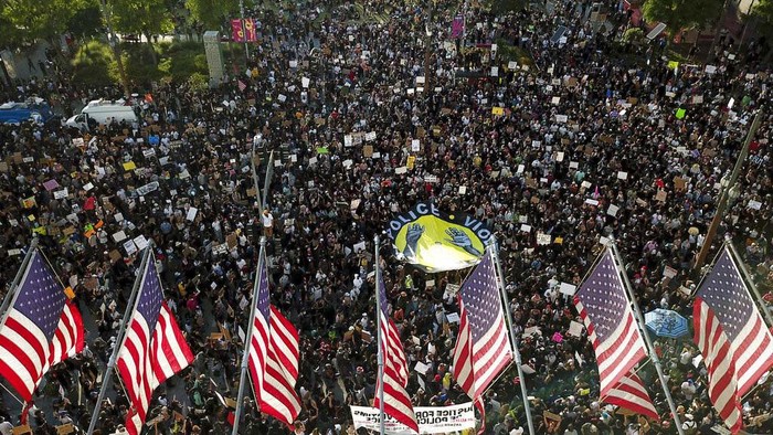 Demonstrators take part in a protest, Wednesday, June 3, 2020, in downtown Los Angeles, sparked by the death of George Floyd, who died May 25 after he was restrained by Minneapolis police. (AP Photo/Ringo H.W. Chiu)