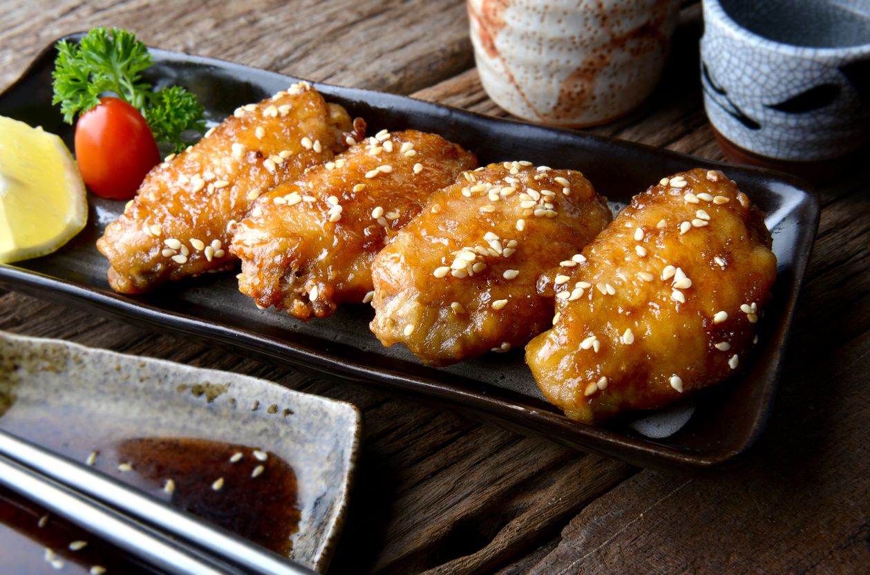 Fried chicken wing with spicy sauce in Japanese style or Tebasaki wing serve in izakaya restourant.