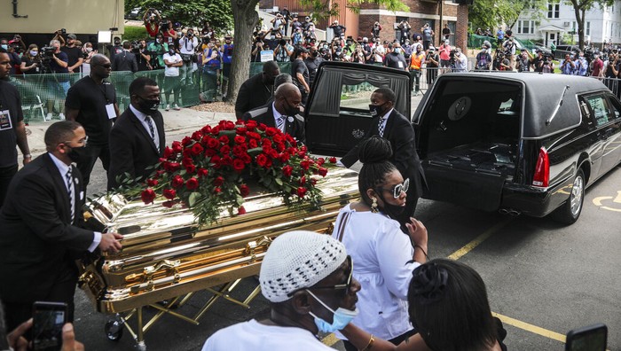 America Protests George Floyd Memorial Members of the Congressional Black Caucus, at right, including Rep. Sheila Jackson-Lee, left, wearing blue face mask, U.S. Rep. Ilhan Omar, second from left, and U.S. Rep. Ayanna Pressley, right, stand at the casket of George Floyd before a memorial service at North Central University, Thursday, June 4, 2020, in Minneapolis. Floyd died on May 25 as a Minneapolis police officer pressed his knee into his neck, ignoring his cries and bystander shouts until he eventually stopped moving. (AP Photo/Bebeto Matthews)