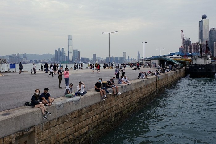 In this picture taken on April 13, 2020, people visit a public cargo loading area dubbed Instagram Pier in Hong Kong. - Starting on March 29 the citys government banned public gatherings of more than four people in an effort to curb the spread of the COVID-19 coronavirus. (Photo by Daniel SUEN / AFP) (Photo by DANIEL SUEN/AFP via Getty Images)