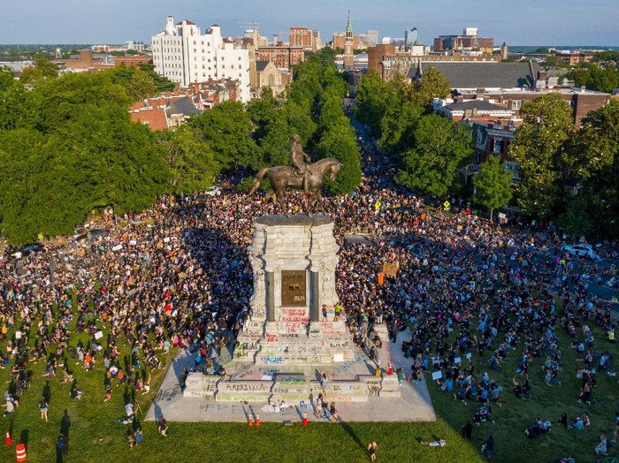 Mandatory Credit: Photo by Steve Helber/AP/Shutterstock (10667306f)
With a drone, a large group of protesters gather around the statue of Confederate General Robert E. Lee on Monument Avenue near downtown, in Richmond, Va. The crowd protesting police brutality chanted Tear it down
America Protests , Richmond, United States - 02 Jun 2020