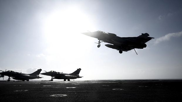A Rafale fighter jet lands on deck of the French aircraft carrier Charles de Gaulle, off the coast of the city of Hyeyres, southern France, Thursday, Jan. 23, 2020. France deploys the Charles de Gaulle aircraft carrier for a three-month mission to support International military operations in the Middle East, French President Emmanuel Macron said. (Philippe Lopez/Pool Photo via AP)