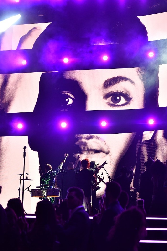 LOS ANGELES, CALIFORNIA - JANUARY 26: An image of the late Prince is projected on a screen while Usher, Sheila E. and FKA Twigs perform onstage during the 62nd Annual GRAMMY Awards at STAPLES Center on January 26, 2020 in Los Angeles, California.   Emma McIntyre/Getty Images for The Recording Academy/AFP