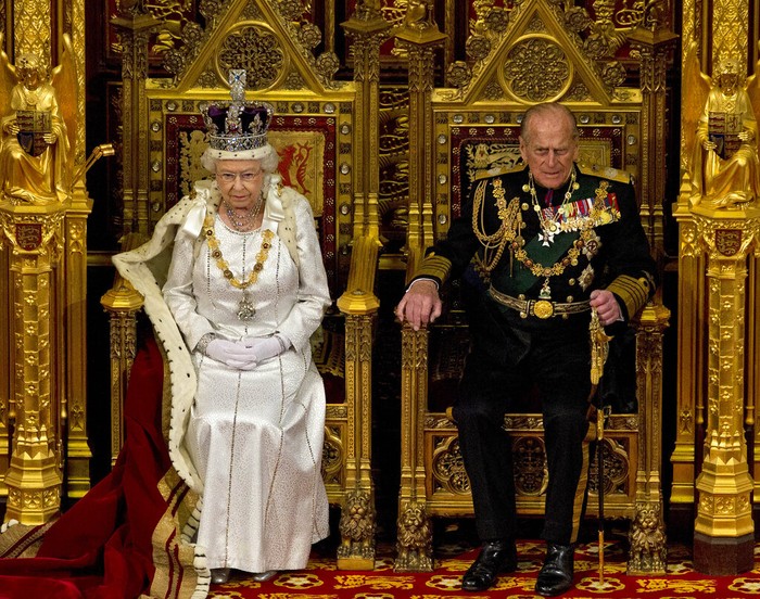 Britain Royals Prince Philip FILE - In this Nov. 20, 1947 file photo, Britain's Princess Elizabeth and Prince Philip wave to the crowds on their wedding day, from the balcony of Buckingham Palace in London. There certainly won’t be fuss. Count on that. When Britain’s Prince Philip reaches the grand age of 99 on Wednesday, he will spend it quietly and in much the same way he’s spent most of his adult life: beside Queen Elizabeth II. (AP Photo/File)
