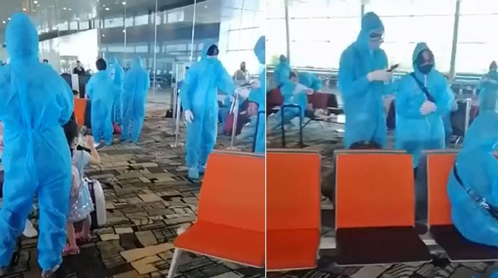 Penumpang Berpakaian APD di Bandara Changi