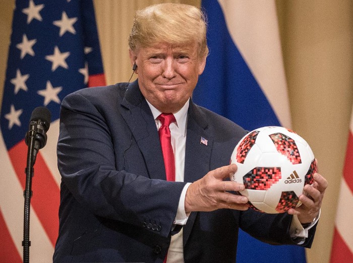 HELSINKI, FINLAND - JULY 16: President Donald Trump shows off a World Cup football given to him by Russian President Vladimir Putin during a joint press conference after their summit on July 16, 2018 in Helsinki, Finland. The two leaders met one-on-one and discussed a range of issues including the 2016 U.S Election collusion.  (Photo by Chris McGrath/Getty Images)