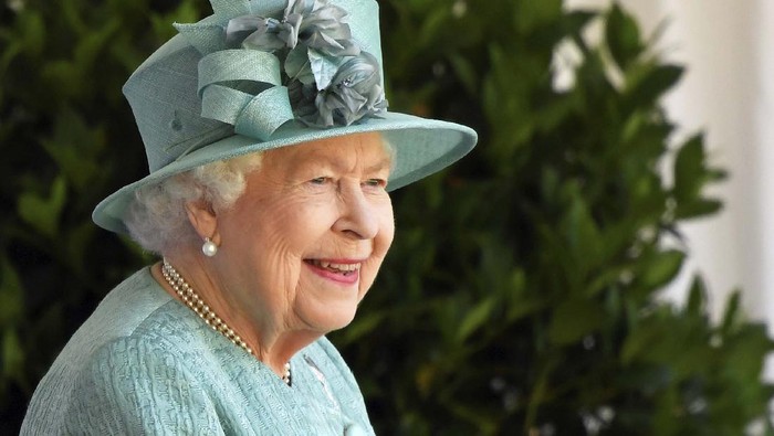 Britain's Queen Elizabeth II looks out during a ceremony to mark her official birthday at Windsor Castle in Windsor, England, Saturday June 13, 2020. Queen Elizabeth II’s birthday is being marked with a special ceremony taking care for social distancing by everyone present amid the coronavirus pandemic. The Queen celebrates her 94th birthday this year. (Paul Edwards/Pool via AP)