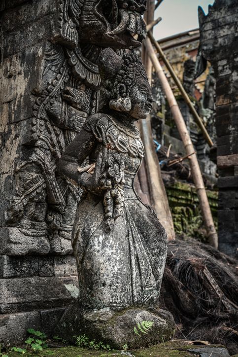 Sculpture of woman in Pura Dalem Segara Madhu, Balinese Hindu temple in northern Bali, Indonesia.