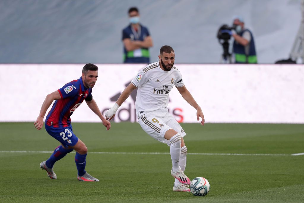 Karim Benzema, Real Madrid MADRID, SPAIN - JUNE 14: Anaitz Arbilla of Eibar battles for possession with Karim Benzema of Real Madrid during the Liga match between Real Madrid CF and SD Eibar SAD at Estadio Alfredo Di Stefano on June 14, 2020 in Madrid, Spain. (Photo by Gonzalo Arroyo Moreno/Getty Images)