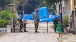 Bangkai Pesawat Hawk 200 Ditutup Terpal dan Dijaga TNI