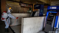 ATM Center juga disemprot disinfektan.