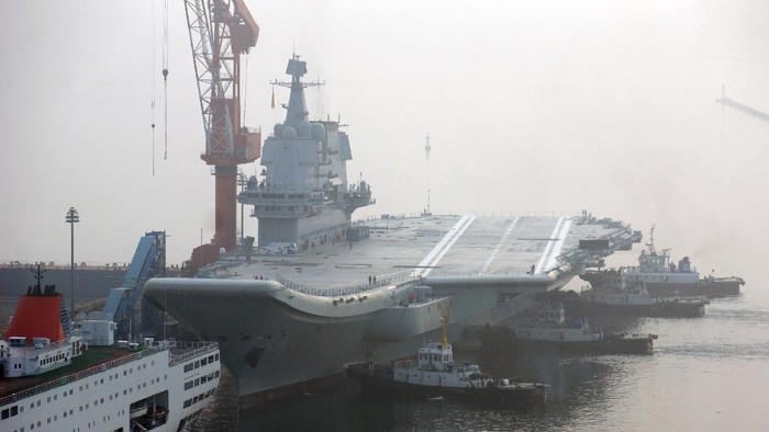 DALIAN, CHINA - MAY 13:  Chinas first home-built aircraft carrier sets out from a port of Dalian DSIC (Dalian Shipbuilding Industry Co.) Shipyard for sea trials on May 13, 2018 in Dalian, Liaoning Province of China.  (Photo by Getty Images)