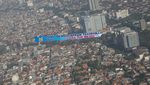 Spanduk Raksasa New Normal Mejeng di Langit Jakarta