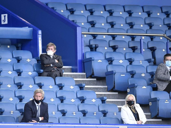 Liverpool's manager Jurgen Klopp and Liverpool's Jordan Henderson leave the field at the end of the English Premier League soccer match between Everton and Liverpool at Goodison Park in Liverpool, England, Sunday, June 21, 2020. (Peter Powell/Pool via AP)
