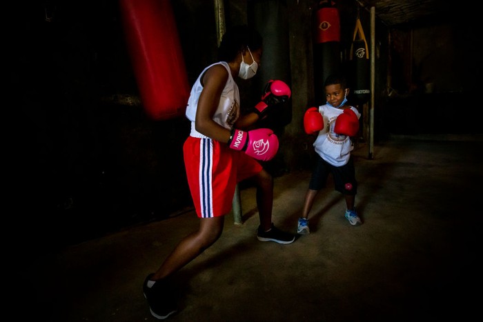 RIO DE JANEIRO, BRAZIL - JUNE 18: Residents of the Tuiuti Community, located in the Benfica neighborhood receive food donations amidst the coronavirus (COVID-19) pandemic on June 18, 2020 in Rio de Janeiro, Brazil. A partnership between the social project 'Mutirao Presente' and the Boxing project 