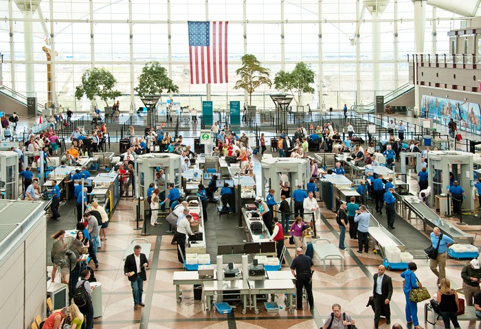 Denver, USA - June 7, 2012: People traveling through security to the gates of Denver International Airport