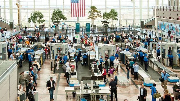 Denver, USA - June 7, 2012: People traveling through security to the gates of Denver International Airport
