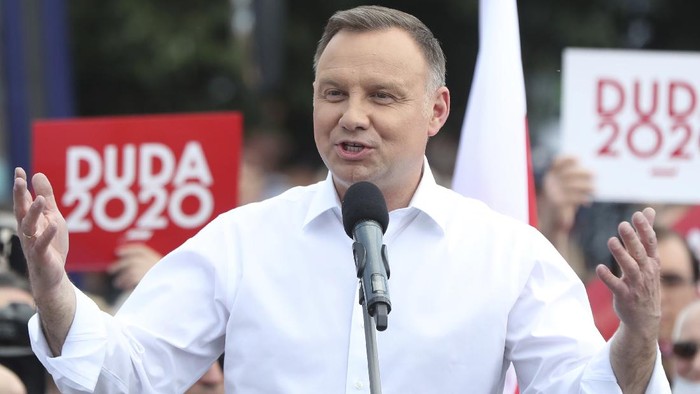 Polish President Andrzej Duda speaks to a crowd as he campaigns ahead of a presidential election later in this month, in Plonsk, Poland, on Tuesday June 16, 2020. Duda is ahead of nine other candidates in opinion polls, but he is not expected to get the 50% needed in the June 28 balloting to avoid a runoff. He is considered most likely to face off in a second round on July 12 against Warsaw mayor Rafal Trzaskowski, whose popularity has been growing.(AP Photo/Czarek Sokolowski)