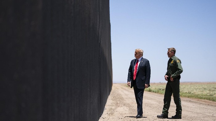 United State Border Patrol chief Rodney Scott gives President Donald Trump a tour of a section of the border wall, Tuesday, June 23, 2020, in San Luis, Ariz. (AP Photo/Evan Vucci)