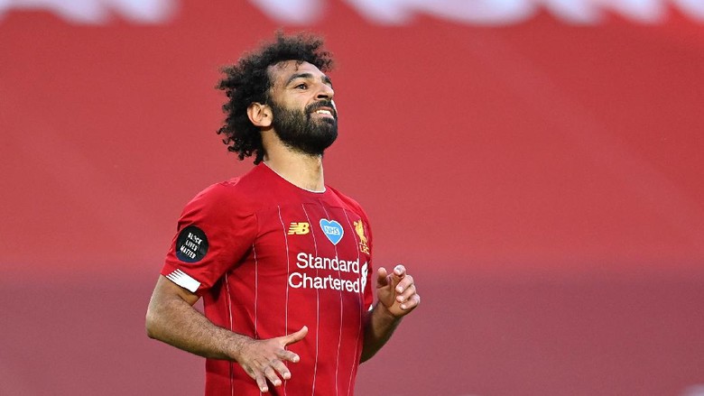 Mohamed Salah LIVERPOOL, ENGLAND - JUNE 24: Mohamed Salah of Liverpool celebrates after scoring his teams second goal during the Premier League match between Liverpool FC and Crystal Palace at Anfield on June 24, 2020 in Liverpool, England. (Photo by Paul Ellis/Pool via Getty Images)