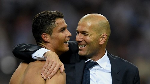 MILAN, ITALY - MAY 28:  Real Madrid head coach Zinedine Zidane hugs a smiling Cristiano Ronaldo of Real Madrid after the UEFA Champions League Final match between Real Madrid and Club Atletico de Madrid at Stadio Giuseppe Meazza on May 28, 2016 in Milan, Italy.  (Photo by Laurence Griffiths/Getty Images)