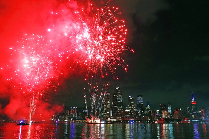 New York Macys Fireworks Fireworks are launched from near the Hudson Yards area of Manhattan as seen from a pier in Hoboken, N.J., Tuesday, June 30, 2020. The fireworks' location was not announced until about an hour before they began to avoid attracting large crowds during the coronavirus pandemic. (AP Photo/Kathy Willens)