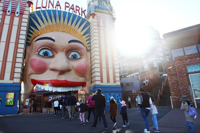 LUNA PARK SYDNEY, AUSTRALIA - JULY 03: Showtime performers including Blip the clown and Meringue social distance during a show at Luna Park on July 03, 2020 in Sydney, Australia. Sydney's Luna Park has reopened to the public following its temporary closure on Monday 23 March in response to the COVID-19 pandemic. Restrictions on entertainment venues, weddings, community sport and other gatherings have been eased across NSW since 1 July, but strict physical distancing measures remain in place. (Photo by Lisa Maree Williams/Getty Images)