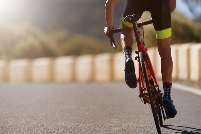 Road bike cyclist man cycling, athlete on a race cycle