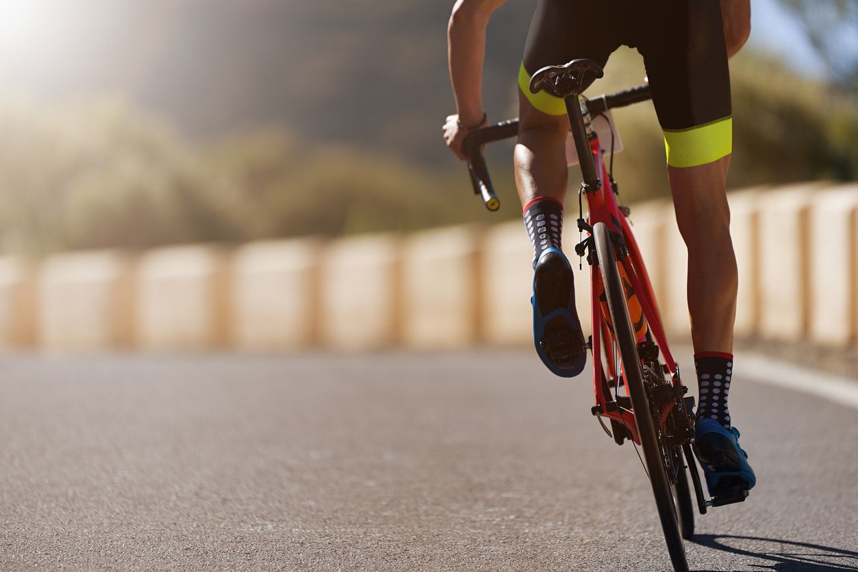 Road bike cyclist man cycling, athlete on a race cycle