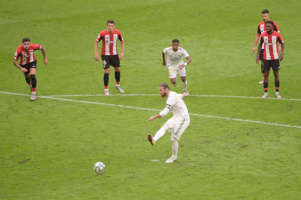 Sergio Ramos BILBAO, SPAIN - JULY 05: Sergio Ramos of Real Madrid scores a penalty for his team's first goal during the La Liga match between Athletic Club and Real Madrid CF at San Mames Stadium on July 05, 2020 in Bilbao, Spain. Football Stadiums around Europe remain empty due to the Coronavirus Pandemic as Government social distancing laws prohibit fans inside venues resulting in all fixtures being played behind closed doors. (Photo by Juan Manuel Serrano Arce/Getty Images)