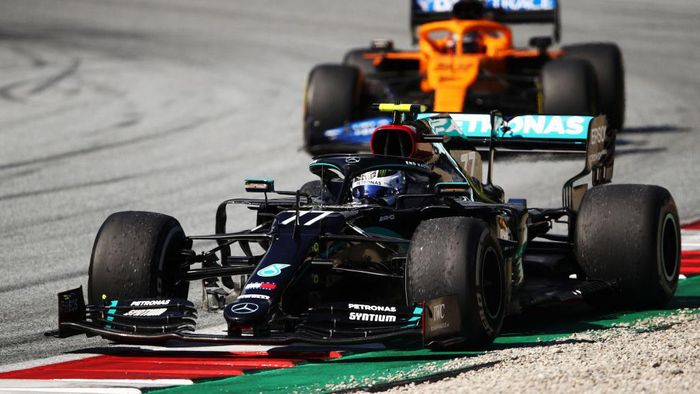 Valtteri Bottas SPIELBERG, AUSTRIA - JULY 05: Race winner Valtteri Bottas of Finland driving the (77) Mercedes AMG Petronas F1 Team Mercedes W11 on a parade lap after the Formula One Grand Prix of Austria at Red Bull Ring on July 05, 2020 in Spielberg, Austria. (Photo by Bryn Lennon/Getty Images)