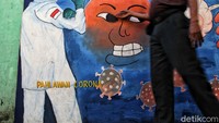 Mural ini merupakan karya warga saat mengikuti lomba bertema COVID-19.