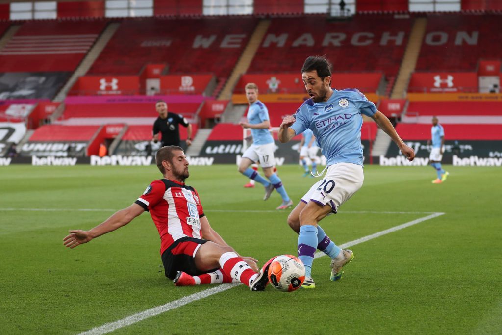 Southampton, manchester city SOUTHAMPTON, ENGLAND - JULY 05: Jack Stephens of Southampton tackles Bernardo Silva of Manchester City during the Premier League match between Southampton FC and Manchester City at St Mary's Stadium on July 05, 2020 in Southampton, England. Football Stadiums around Europe remain empty due to the Coronavirus Pandemic as Government social distancing laws prohibit fans inside venues resulting in games being played behind closed doors. (Photo by Catherine Ivill/Getty Images)