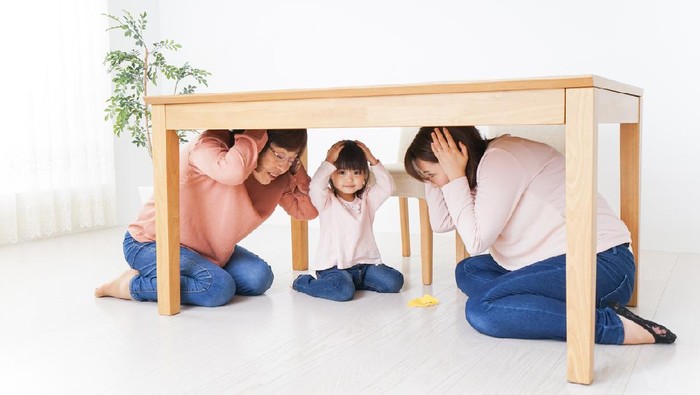 Family taking shelter under the desk
