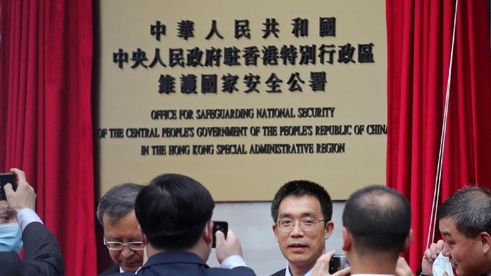 Mainland Chinese Communist Party officials and Hong Kong officials attend an opening ceremony for Chinas new Office for Safeguarding National Security in Hong Kong, Wednesday, July 8, 2020. Chinas new national security office in Hong Kong got off to an early start on Wednesday with an official opening amidst heavy police presence. (AP Photo/Kin Cheung)