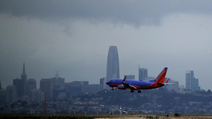 BURLINGAME, CALIFORNIA - MARCH 06: A Southwest Airlines plane lands at San Francisco International Airport on March 06, 2020 in Burlingame, California. In the wake of the COVID-19 outbreak, airlines are facing significant losses as people are cancelling travel plans and businesses are restricting travel. Southwest Airlines says they expect to lose between $200 to $300 million dollars in the coming weeks. Other airlines like United and Jet Blue are cutting flights. The International Air Transport Association predicts that carriers could lose between $63 billion and $113 billion this year.   Justin Sullivan/Getty Images/AFP