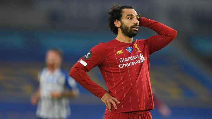 Mohamed Salah BRIGHTON, ENGLAND - JULY 08: Mohamed Salah of Liverpool reacts during the Premier League match between Brighton & Hove Albion and Liverpool FC at American Express Community Stadium on July 08, 2020 in Brighton, England. Football Stadiums around Europe remain empty due to the Coronavirus Pandemic as Government social distancing laws prohibit fans inside venues resulting in all fixtures being played behind closed doors. (Photo by Daniel Leal Olivas/Pool via Getty Images)