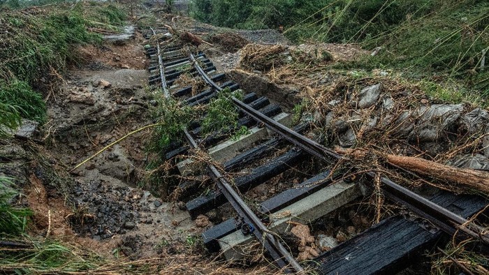 HITOYOSHI, JAPAN - JULY 05: A railway bridge over the Kuma River is destroyed after torrential rain caused the river to burst its banks, on July 5, 2020 in Hitoyoshi, Japan. Around 16 people are believed to be dead and 9 missing after unprecedented torrential rain fell in Kumamoto prefecture causing widespread flooding and landslides. (Photo by Carl Court/Getty Images)