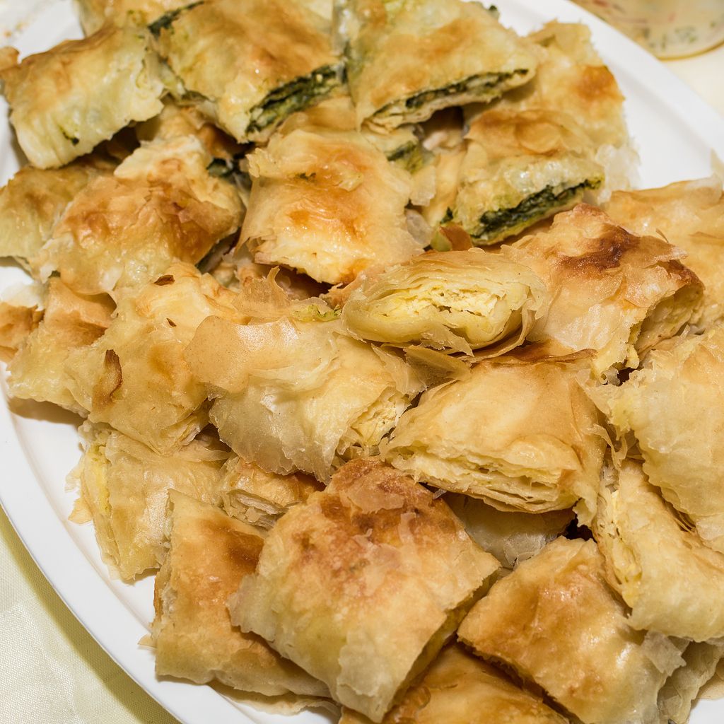 Traditional Serbian cheese pie gibanica and spinach pie in plate