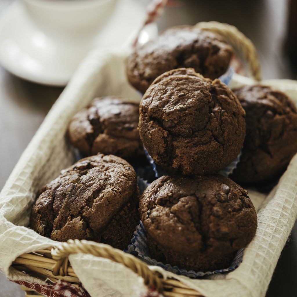 Chocolate muffins on wooden board. Sweet food. Tasty chocolate cakes